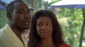 Movie still from “The Brothers” (2001), directed by Gary Hardwick – A man and a woman standing next to each other; Close Up shot, Over the shoulder angle