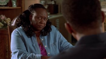 Movie still from “The Brothers” (2001), directed by Gary Hardwick – An older woman sitting in front of a younger man; Close Up shot, Over the shoulder angle