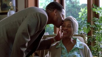Movie still from “The Brothers” (2001), directed by Gary Hardwick – An older woman sitting next to a young man; Close Up shot, Low angle