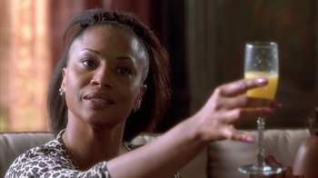 Movie still from “The Brothers” (2001), directed by Gary Hardwick – A person holding a glass of wine; Close Up shot, Low angle