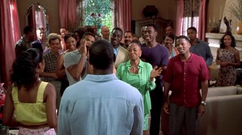 Movie still from “The Brothers” (2001), directed by Gary Hardwick – A group of people standing in front of a window; Wide shot, Over the shoulder angle