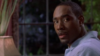 Movie still from “The Brothers” (2001), directed by Gary Hardwick – A man's face in front of a window; Close Up shot, Low angle
