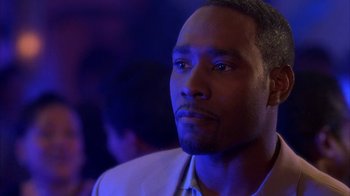 Movie still from “The Brothers” (2001), directed by Gary Hardwick – A person wearing a suit and tie; Close Up shot, Over the shoulder angle