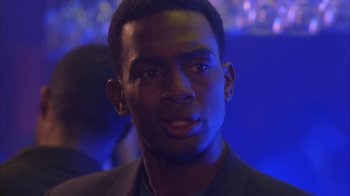 Movie still from “The Brothers” (2001), directed by Gary Hardwick – A person wearing a suit; Close Up shot, Over the shoulder angle