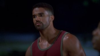 Movie still from “The Brothers” (2001), directed by Gary Hardwick – A person wearing a tank top; Close Up shot, High angle