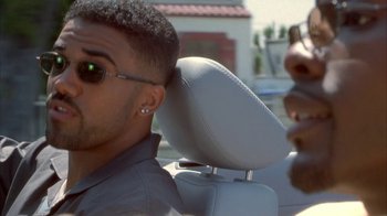 Movie still from “The Brothers” (2001), directed by Gary Hardwick – A man in a car with his hand on his head; Close Up shot, Over the shoulder angle