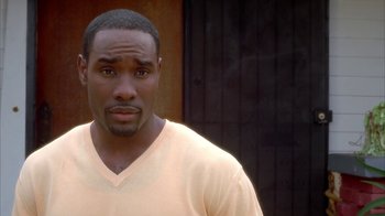 Movie still from “The Brothers” (2001), directed by Gary Hardwick – A person wearing a white t - shirt; Close Up shot, High angle
