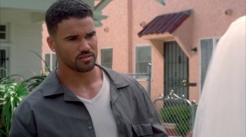 Movie still from “The Brothers” (2001), directed by Gary Hardwick – A person outside near a building; Close Up shot, Over the shoulder angle