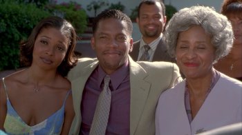 Movie still from “The Brothers” (2001), directed by Gary Hardwick – A group of people standing next to each other; Medium shot, High angle