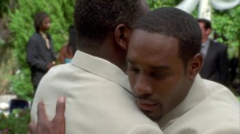 Movie still from “The Brothers” (2001), directed by Gary Hardwick – A couple of people that are hugging each other; Close Up shot, Over the shoulder angle