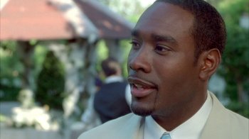 Movie still from “The Brothers” (2001), directed by Gary Hardwick – A person wearing a white shirt and tie; Close Up shot, Over the shoulder angle