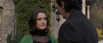 Movie still from “The Brothers Bloom” (2008), directed by Rian Johnson – A man and a woman standing next to each other; Close Up shot, Over the shoulder angle