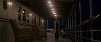 Movie still from “The Brothers Bloom” (2008), directed by Rian Johnson – A woman standing on a deck at night; Wide shot, High angle