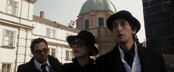 Movie still from “The Brothers Bloom” (2008), directed by Rian Johnson – A man and a woman wearing hats and sunglasses; Medium shot, Low angle