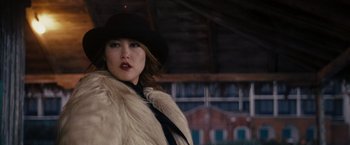 Movie still from “The Brothers Bloom” (2008), directed by Rian Johnson – A woman wearing a hat and a fur coat; Close Up shot, Low angle