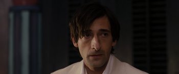 Movie still from “The Brothers Bloom” (2008), directed by Rian Johnson – A person with long hair; Close Up shot, Over the shoulder angle