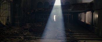 Movie still from “The Brothers Bloom” (2008), directed by Rian Johnson – The light is shining through a hole in the floor; Extreme Wide shot, Low angle