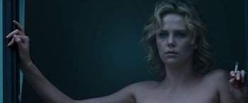 Movie still from “The Burning Plain” (2008), directed by Guillermo Arriaga – A beautiful woman with blonde hair posing for the camera; Close Up shot, Low angle