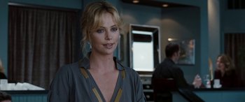 Movie still from “The Burning Plain” (2008), directed by Guillermo Arriaga – Charlize theron in a scene from the movie prometheus; Close Up shot, Over the shoulder angle