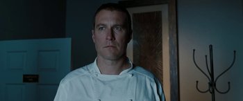 Movie still from “The Burning Plain” (2008), directed by Guillermo Arriaga – A person wearing a chef's outfit; Close Up shot, Low angle