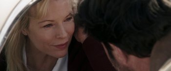 Movie still from “The Burning Plain” (2008), directed by Guillermo Arriaga – An older woman and a younger man touching each other's face; Close Up shot, Over the shoulder angle