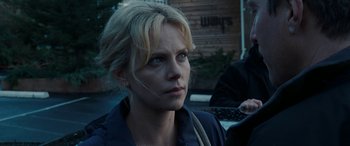 Movie still from “The Burning Plain” (2008), directed by Guillermo Arriaga – A person wearing a jacket; Close Up shot, Over the shoulder angle