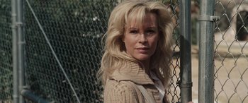 Movie still from “The Burning Plain” (2008), directed by Guillermo Arriaga – A woman with blonde hair wearing a beige sweater; Close Up shot, Over the shoulder angle