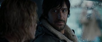 Movie still from “The Burning Plain” (2008), directed by Guillermo Arriaga – A person wearing a jacket; Close Up shot, Over the shoulder angle