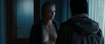 Movie still from “The Burning Plain” (2008), directed by Guillermo Arriaga – A woman is standing in front of a mirror; Close Up shot, Over the shoulder angle