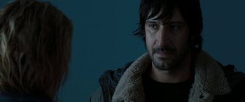 Movie still from “The Burning Plain” (2008), directed by Guillermo Arriaga – A person wearing a jacket; Close Up shot, Over the shoulder angle