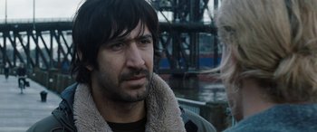 Movie still from “The Burning Plain” (2008), directed by Guillermo Arriaga – A person wearing a jacket; Close Up shot, Over the shoulder angle