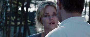 Movie still from “The Burning Plain” (2008), directed by Guillermo Arriaga – A person looking at a person; Close Up shot, Over the shoulder angle