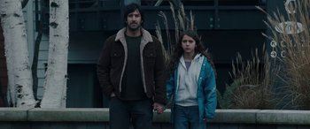 Movie still from “The Burning Plain” (2008), directed by Guillermo Arriaga – A man and a woman holding hands while standing next to each other; Medium shot, Low angle