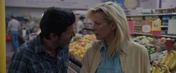 Movie still from “The Burning Plain” (2008), directed by Guillermo Arriaga – A man and a woman in a grocery store; Close Up shot, Over the shoulder angle