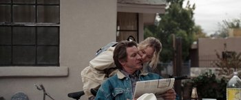 Movie still from “The Burning Plain” (2008), directed by Guillermo Arriaga – A man and a woman reading a newspaper together; Medium shot, Over the shoulder angle