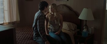 Movie still from “The Burning Plain” (2008), directed by Guillermo Arriaga – A man and a woman sitting on a bed together; Medium shot, Over the shoulder angle