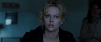 Movie still from “The Burning Plain” (2008), directed by Guillermo Arriaga – A person with blue eyes; Close Up shot, Over the shoulder angle