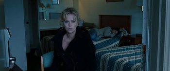 Movie still from “The Burning Plain” (2008), directed by Guillermo Arriaga – Charlize theron in a scene from the movie a million ways to die in the west; Medium shot, High angle
