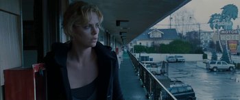 Movie still from “The Burning Plain” (2008), directed by Guillermo Arriaga – Charlize theron in the movie a million little pieces; Medium shot, Low angle