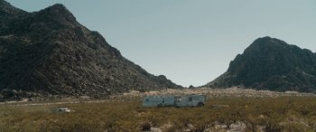 Movie still from “The Burning Plain” (2008), directed by Guillermo Arriaga – Three trailers in the middle of the desert; Extreme Wide shot, Low angle