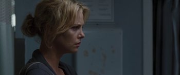 Movie still from “The Burning Plain” (2008), directed by Guillermo Arriaga – Charlize theron in a scene from the movie prometheus; Close Up shot, Over the shoulder angle