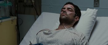 Movie still from “The Burning Plain” (2008), directed by Guillermo Arriaga – A man in a hospital bed with his eyes closed; Close Up shot, High angle