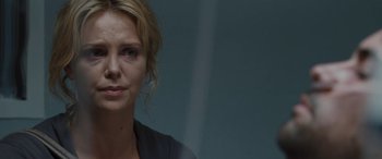 A woman's face in front of a window