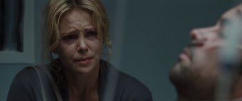 Movie still from “The Burning Plain” (2008), directed by Guillermo Arriaga – A person crying in a room; Close Up shot, Over the shoulder angle