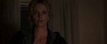 Movie still from “The Burning Plain” (2008), directed by Guillermo Arriaga – A person wearing a jacket; Close Up shot, Over the shoulder angle