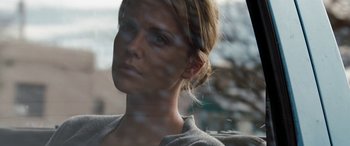 Movie still from “The Burning Plain” (2008), directed by Guillermo Arriaga – A person looking out of a car window; Close Up shot, Low angle
