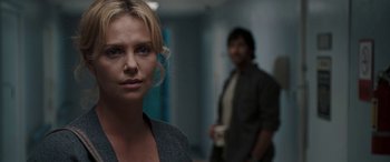 Movie still from “The Burning Plain” (2008), directed by Guillermo Arriaga – A woman standing next to a man holding a coffee cup; Close Up shot, Over the shoulder angle