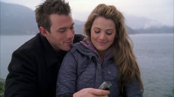 Movie still from “The Butterfly Effect 2” (2006), directed by John R. Leonetti – A man and a woman looking at a cell phone; Close Up shot, Over the shoulder angle