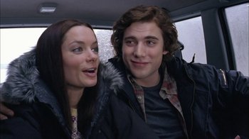 Movie still from “The Butterfly Effect 2” (2006), directed by John R. Leonetti – A man and a woman sitting next to each other in a car; Close Up shot, Low angle