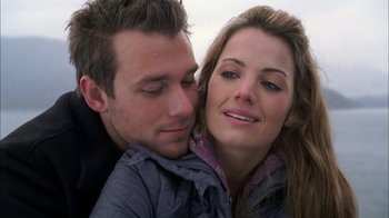 Movie still from “The Butterfly Effect 2” (2006), directed by John R. Leonetti – A person and a woman with their eyes closed; Close Up shot, Over the shoulder angle